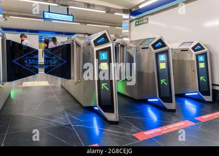 MADRID, SPAIN - Jul 16, 2021: Modern machines in the Reopening of the modern Gran Via metro station in Madrid, Spain Stock Photo