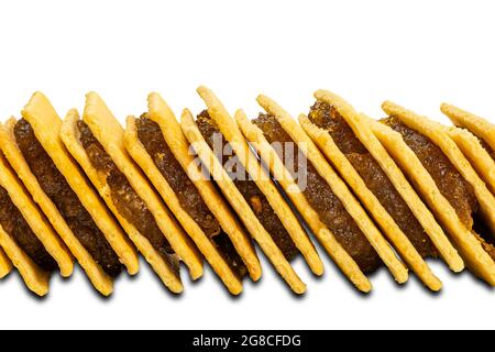 Side view stack of pineapple cheese shake biscuit isolated on white background with clipping path. Stock Photo