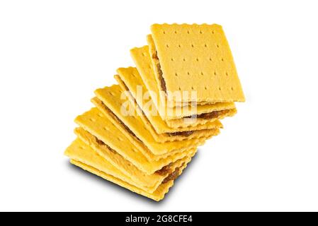 High angle view stack of homemade crispy cheese cake biscuit filled with pineapple jam on white background with clipping path. Stock Photo