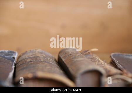 Antique books on the shelf in the library Stock Photo