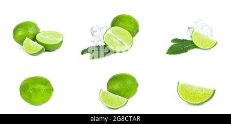 Fresh green juicy limes, lime slices, ice and mint leaves set isolated on white background. Stock Photo