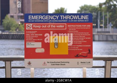 Salford, Greater Manchester, UK. 19th July 2021. Emergency throwline. Teenage swimmer dies at Salford Quays. Emergency Services recovered the body of a 19-year-old man from the water at Salford Quays, Salford, Greater Manchester, UK, on 18th July, 2021, at 7.40pm. The search took three hours. During that day many swimmers were diving into the water. The UK is in a heatwave with temperatures exceeding 30C in some places. The man who died in the water at Salford Quays has been named as Ngapee Merenga. Credit: Terry Waller/Alamy Live News Stock Photo