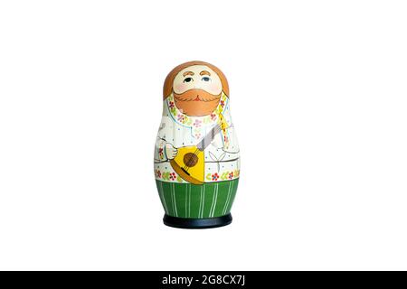 A colourful Matryoshka stacking wooden doll on a white background. Stock Photo