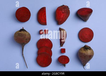 Chopped ripe red beet on violet background Stock Photo