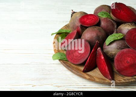 Ripe red beet on white wooden table Stock Photo
