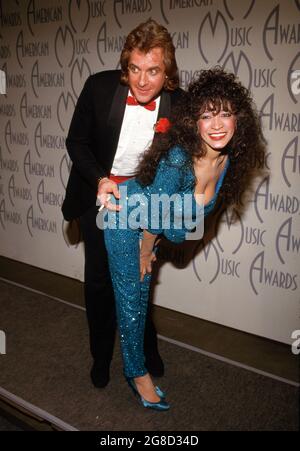 Eddie Money and Ronnie Spector at 14th Annual American Music Awards on January 26, 1987 at the Shrine Auditorium in Los Angeles, California  Credit: Ralph Dominguez/MediaPunch Stock Photo