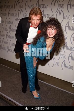 Eddie Money and Ronnie Spector at 14th Annual American Music Awards on January 26, 1987 at the Shrine Auditorium in Los Angeles, California  Credit: Ralph Dominguez/MediaPunch Stock Photo