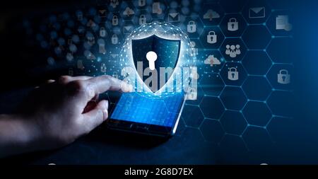 shield with key inside on blue background The concept of cybersecurity the Internet Stock Photo