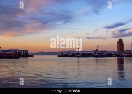 View at dusk, over the V&A waterfront, part of the Cape Town Harbour in South Africa. Stock Photo