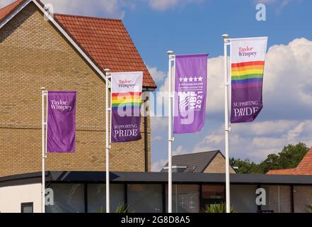 Taylor Wimpey advertising flag banner supporting Pride at a new housing development. UK Stock Photo