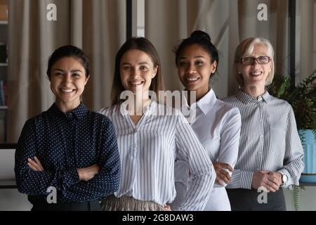 Portrait of happy diverse female business team Stock Photo