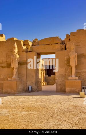 Views of the temple of Ramses III with Osiris pillars in the courtyard ...