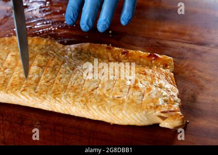 Grilled salmon on the grill with grill marks. On wooden background ...