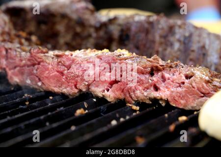 Fraldinha. Steak. Traditional cut of meat for a Brazilian barbecue. Meat on the grill. Stock Photo