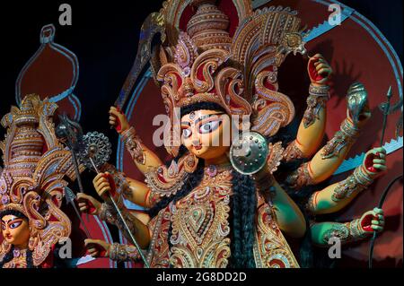 Decorated Goddess Durga idol , Durga Puja festival at night. Shot under colored light at Howrah, West Bengal, India. Biggest festival of Hinduism , Stock Photo