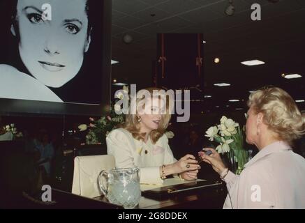 Los Angeles.CA.USA.  LIBRARY. Catherine Deneuve promoting her perfume range Deneuve at an event.  April 1987.  ReCaptioned 16.07.21 Ref:LMK30-SLIB1607210PBOR-001 Peter Borsari/PIP-Landmark Media WWW.LMKMEDIA.COM.
