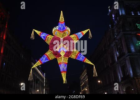 A huge �辱ñ���ٲ� hangs over a street near the zocalo in Mexico City Stock Photo