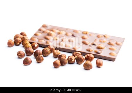 Chocolate bar with hazelnuts isolated on white background. Stock Photo
