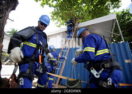 salvador, bahia, brazil - february 28, 2019: Electrician works on temporary connection in electrical network in Salvador city. Stock Photo