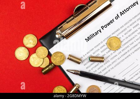 Military power of attorney form. Office business desktop with money and pistol shells. Top view Stock Photo