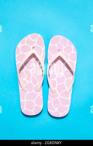 Pink slippers on blue background Stock Photo
