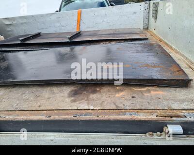 Old heating oil tank in dingy dank basement. Stock Photo