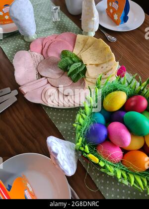 Traditional easter breakfast table with decorated eggs Stock Photo