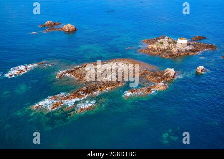 Aerial drone image of Icho Tower at high tide in the sunshine. Jersey Channel Islands. Stock Photo