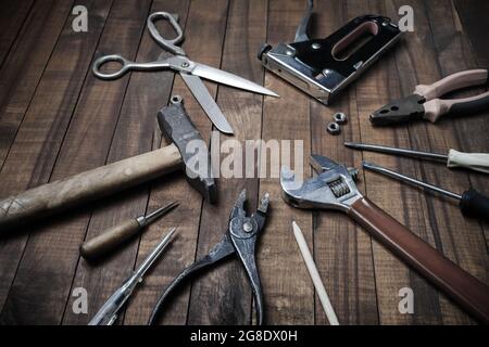 Set of different tools on vintage wood table background. Stock Photo