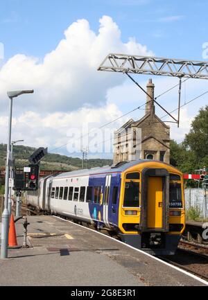 Northern three car class 158 express sprinter dmu, number 158 755, leaving Carnforth railway station on Monday 19th July 2021 with passenger train. Stock Photo