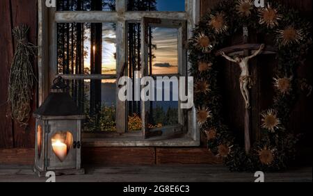 Rustic farmhouse parlor in candlelight, crucifix, Black Forest, Baden-Wuerttemberg, composing, Germany Stock Photo