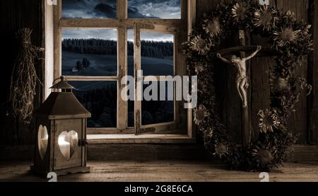 Rustic farmhouse in candlelight, crucifix, monochrome, Black Forest, Baden-Wuerttemberg, composing, Germany Stock Photo