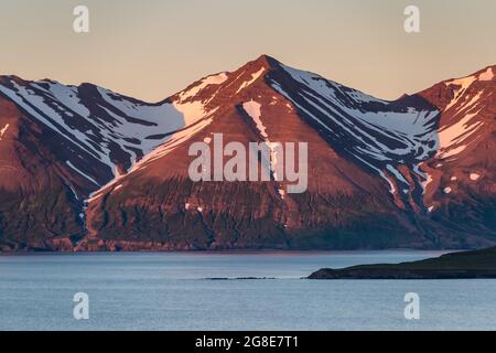 Mountains in the evening light, Hrisey Island, Eyjafjoerour, North Iceland, Iceland Stock Photo