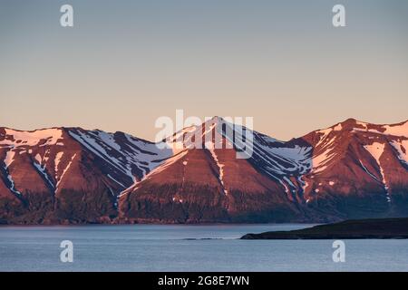 Mountains in the evening light, Hrisey Island, Eyjafjoerour, North Iceland, Iceland Stock Photo