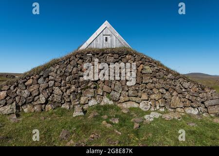 Lonely hut with stone wall, high temperature area or geothermal area Hveravellir, Kjoelur, Highland, Iceland Stock Photo