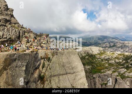 Hikers on rocks, hiking trail to Preikestolen, Ryfylke, Rogaland, Norway Stock Photo