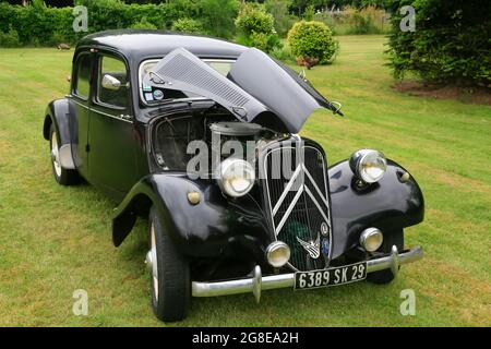 Oldtimer Citroen Traction 11 BL legere from 1957 in black, 4 cylinder inline engine, 1911 cm3, 125 km/h, in a park, Bretagne, France Stock Photo