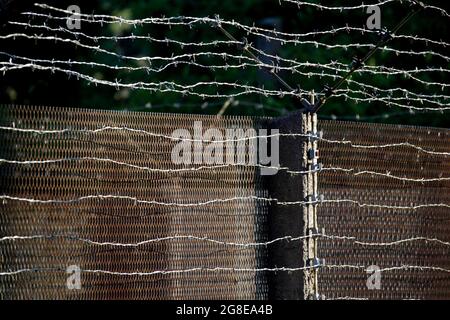 Border fence, expanded metal fence, border signal fence, barbed wire fence, GDR border tower in Moedlareuth, former divided city on the German-German Stock Photo