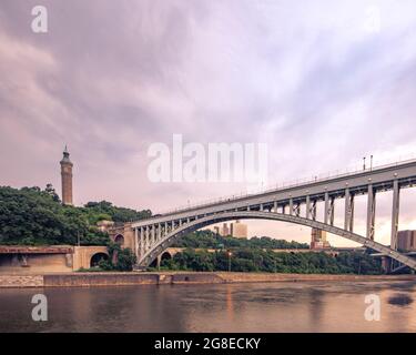 Bronx, NY - USA - July 17, 2021: Wide horizontal view of the historic High Bridge spanning the Harlem River and Highbridge Water Tower is the distance Stock Photo