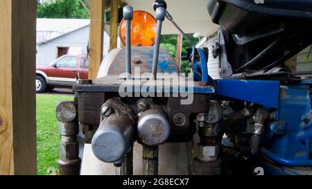 A Close Up of Hydraulic Levers on a Tractor Stock Photo