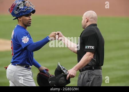 Umpires Laz Diaz and Mike Estabrook (L) comment to St. Louis Cardinals  manager Mike Matheny about the blue uniforms before a game against the  Milwaukee Brewers at Busch Stadium in St. Louis