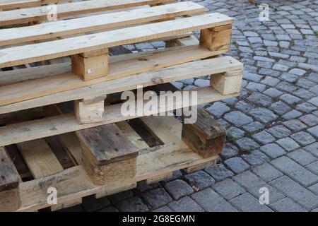 Close-up view of a stack of used wooden pallets. Stock Photo