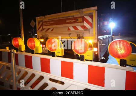 Hamburg, Germany. 18th Mar, 2021. Barrier grids are placed on the slip road of the Othmarschen junction of the closed A7 motorway in the evening. The motorway was closed for 79 hours due to several bridge demolitions. Credit: Bodo Marks/dpa/Bodo Marks/dpa/Alamy Live News Stock Photo