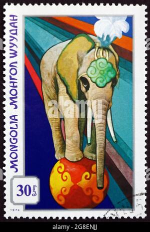 MONGOLIA - CIRCA 1974: a stamp printed in Mongolia shows Trained Elephant, Mongolian Circus, circa 1982 Stock Photo