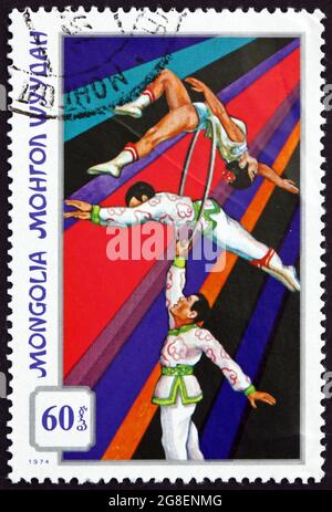 MONGOLIA - CIRCA 1974: a stamp printed in Mongolia shows Acrobats with Ring, Mongolian Circus, circa 1974 Stock Photo