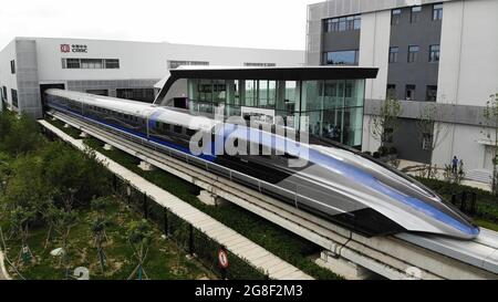 Qingdao, China. 20th July, 2021. Aerial photo taken on July 20, 2021 shows China's new maglev transportation system in Qingdao, east China's Shandong Province. China's new high-speed maglev train rolled off the production line on Tuesday. It has a designed top speed of 600 km per hour -- currently the fastest ground vehicle available globally. The new maglev transportation system made its public debut in the coastal city of Qingdao, east China's Shandong Province. Credit: Xinhua/Alamy Live News Stock Photo