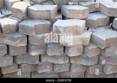 Warehouse paving slabs for laying road construction. Pavement stone at construction site. Construction of sidewalks. Stock Photo