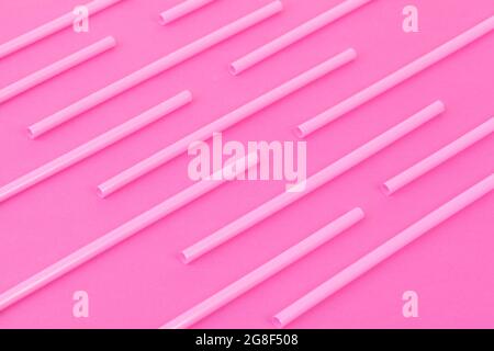 Drinking straws on bright pink background, top view Stock Photo