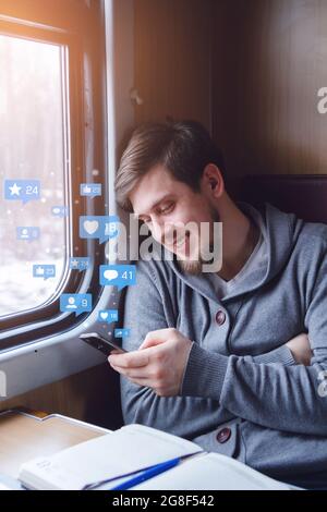 Young man using smartphone with icon notification.Social media or social network concept. Stock Photo
