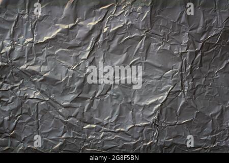 Wrinkled aluminum foil after used for cooking Stock Photo